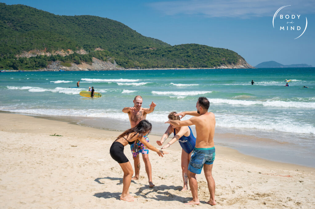 Enjoy surfing journey at BodyVaMind retreat vietnam - happy customers all in one team