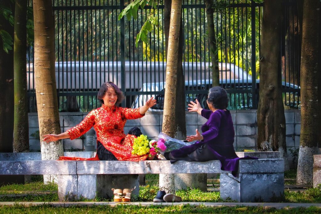 women, vietnam, laugh, gesture, friends, outdoors, joy