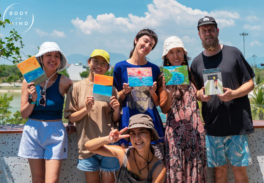 6 guests at BodyVaMind retreat show their paintings after the art workshop about their happy moments